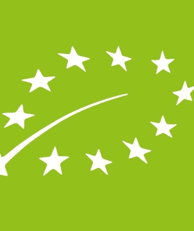 Logo representing the European Union organic certification with stars and a curved line on a green background. - Olive Oil Times