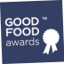 Logo of the Good Food Awards featuring a ribbon and text on a blue background. - Olive Oil Times