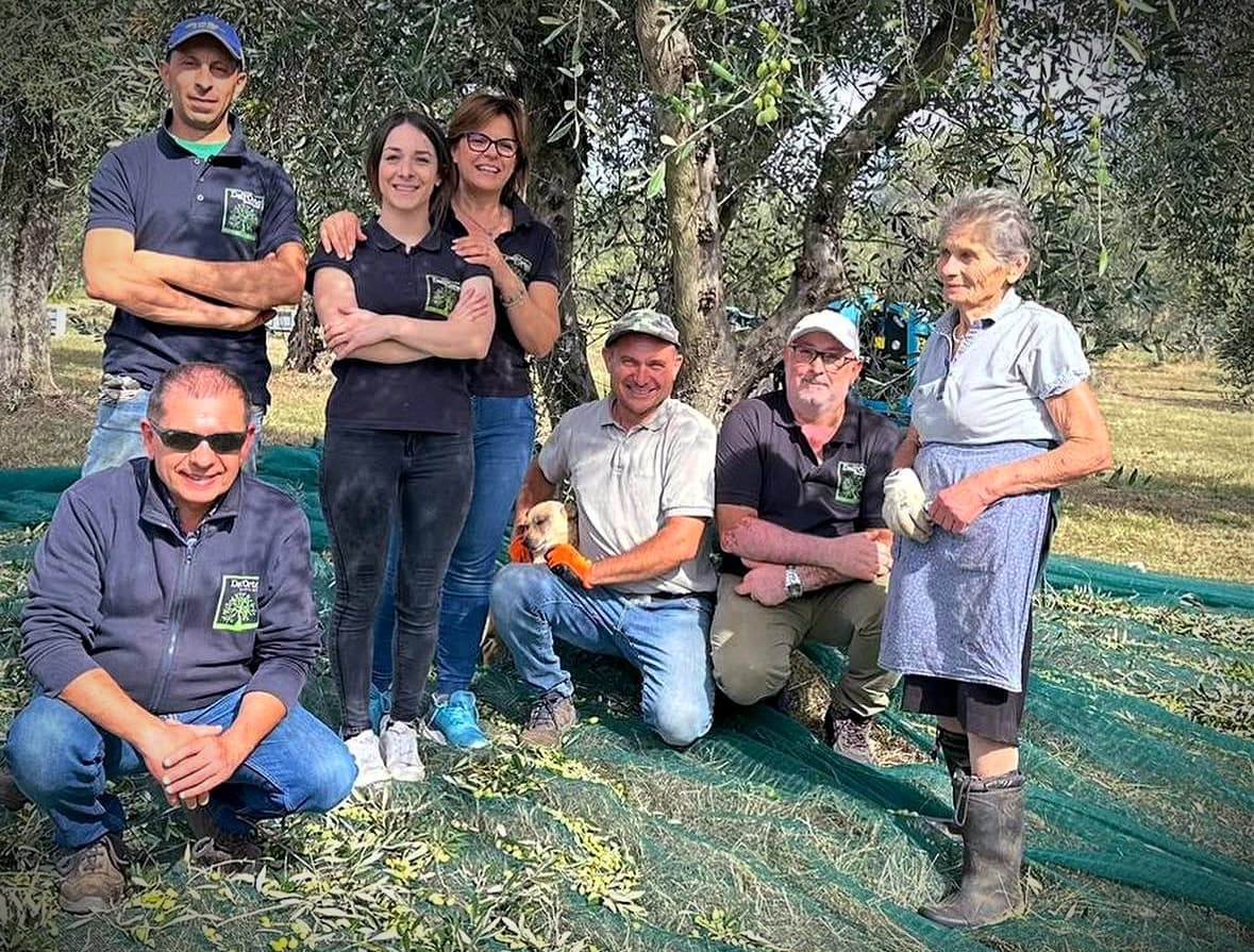 Polidoro Dell Orto (bottom left) with family and coworkers during harvest at Dell Orto farm