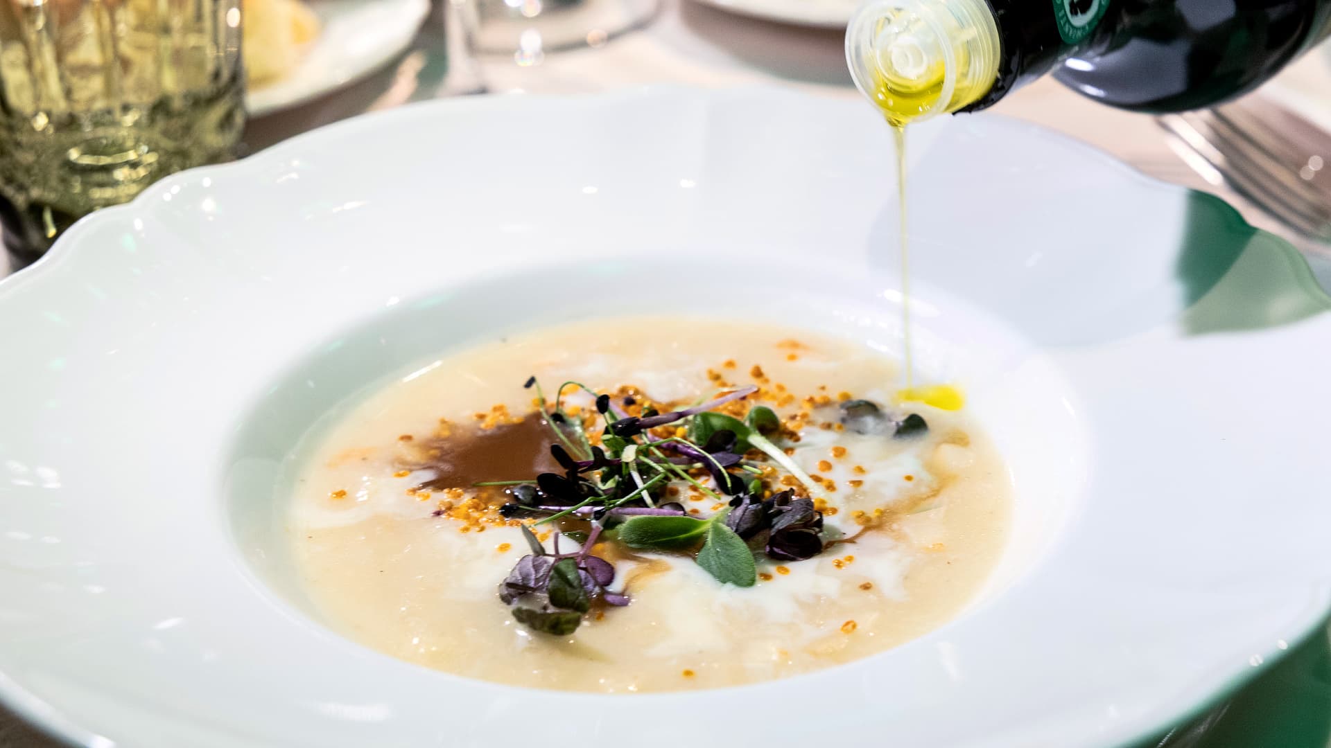 Celeriac faux risotto, its reduction, Galaverna fondue, and pollen by Chef Andrea Perini (Photo by Consorzio Olio DOP Chianti Classico)