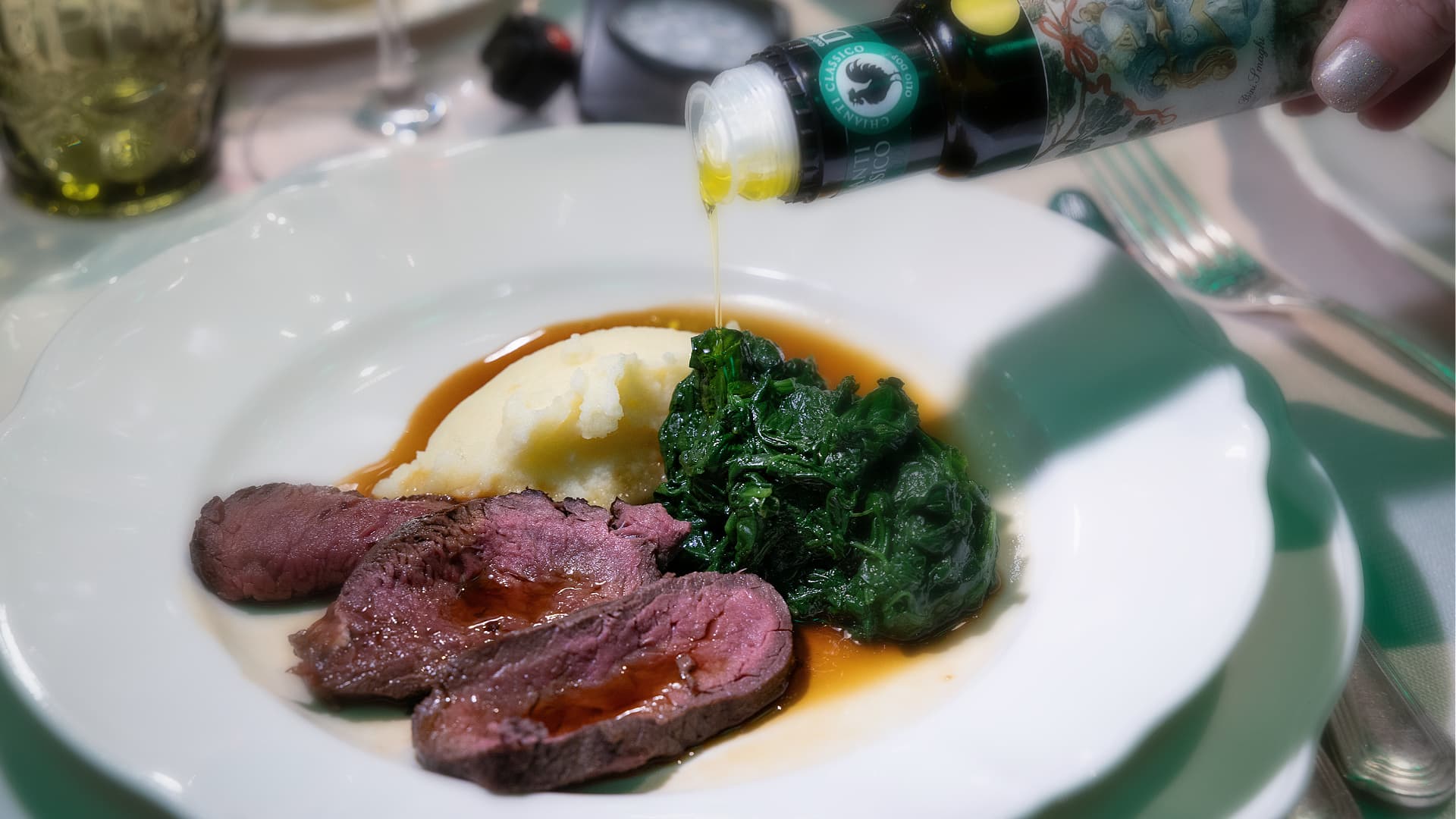 Fallow deer sirloin with borlotti bean purée and a baby spinach rollatina by Chef Andrea Perini (Photo by Consorzio Olio DOP Chianti Classico)