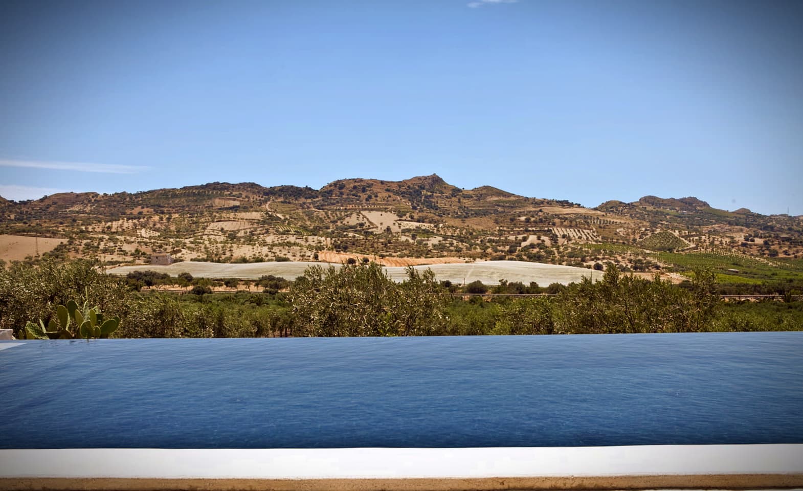 Pool overlooking Mandranova in Palma di Montechiaro (Sicily)