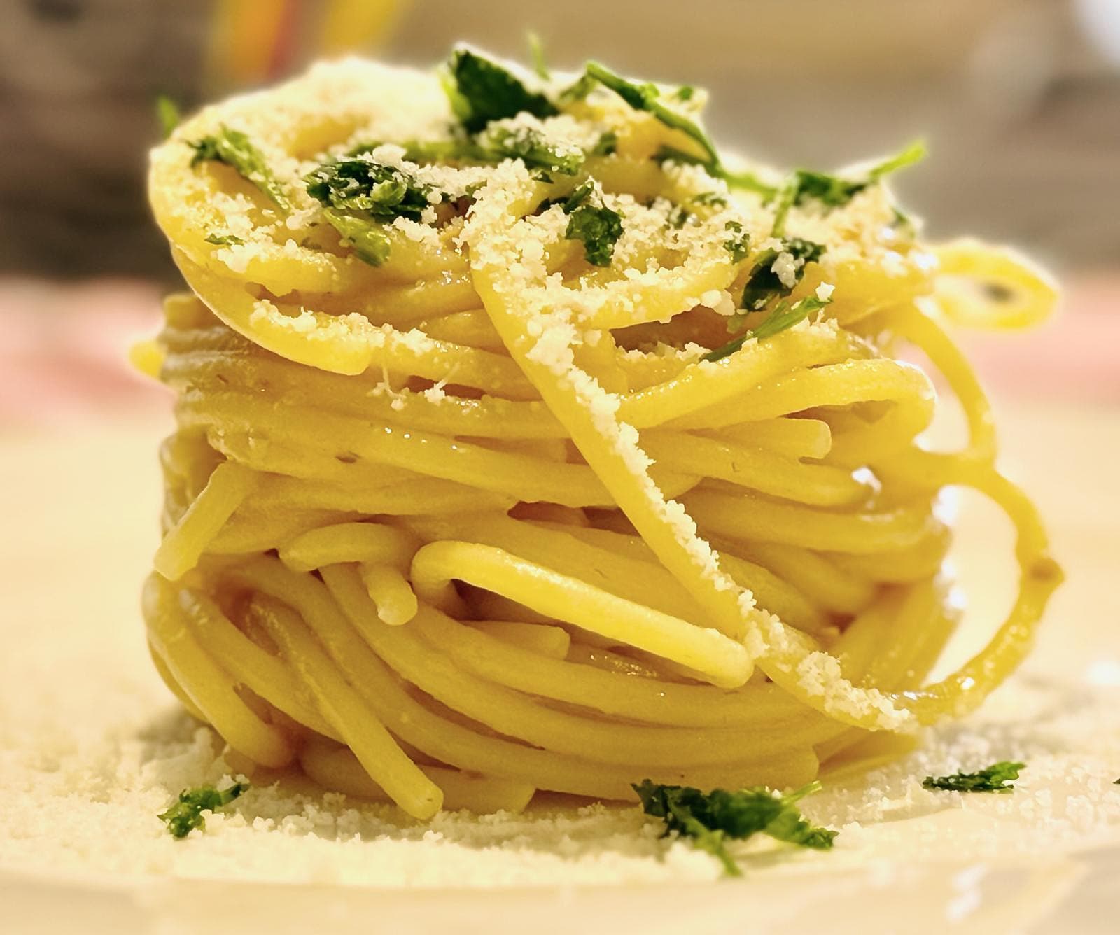 Spaghetti with yellow cherry tomatoes, anchovies, pecorino romano, lemon zest, parsley and extra virgin olive oil (Photo by Ylenia Granitto)