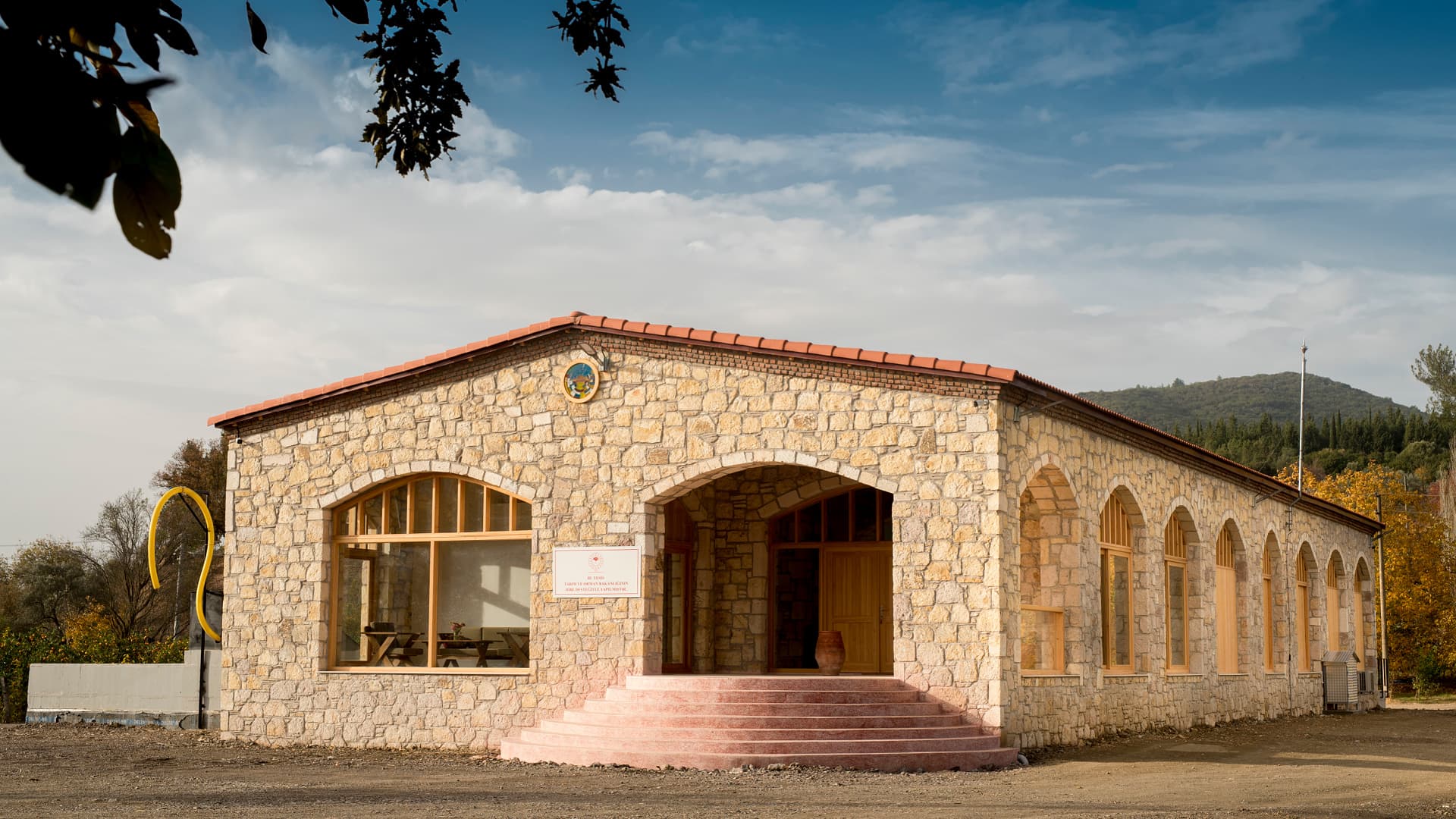 Exterior view of the Yücel Sönmez Olive Oil Library in Seferihisar, where visitors explore a curated collection of olive oils celebrating Anatolia’s cultivars and the broader diversity of the olive oil world.