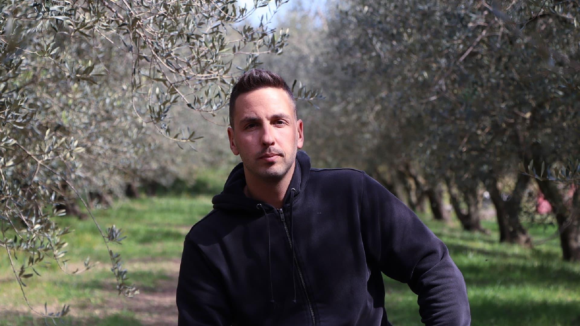 Martin Adamič in the family’s olive grove at Ronkaldo, near Izola. (Photo: Jaka Ivančić)