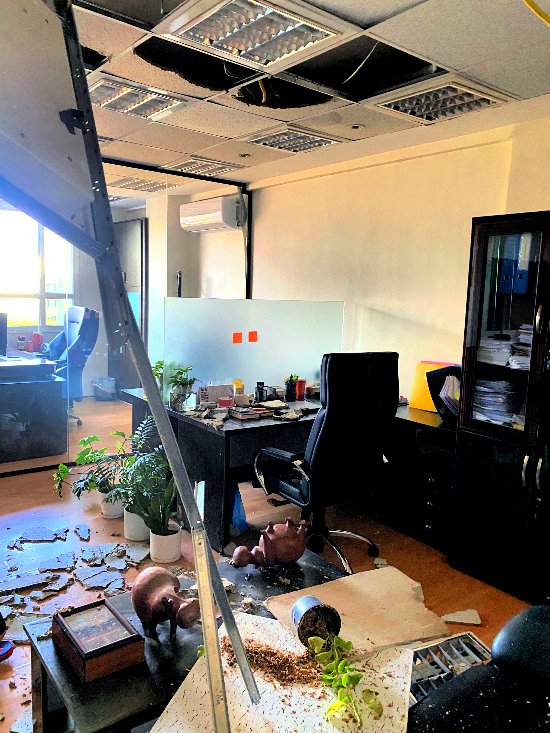 Orum Araz Nikdaneh’s office in Tehran was damaged by shrapnel in the opening days of the U.S.-Israel bombing of Iran. (Photo: Saeed Shahmoradi)