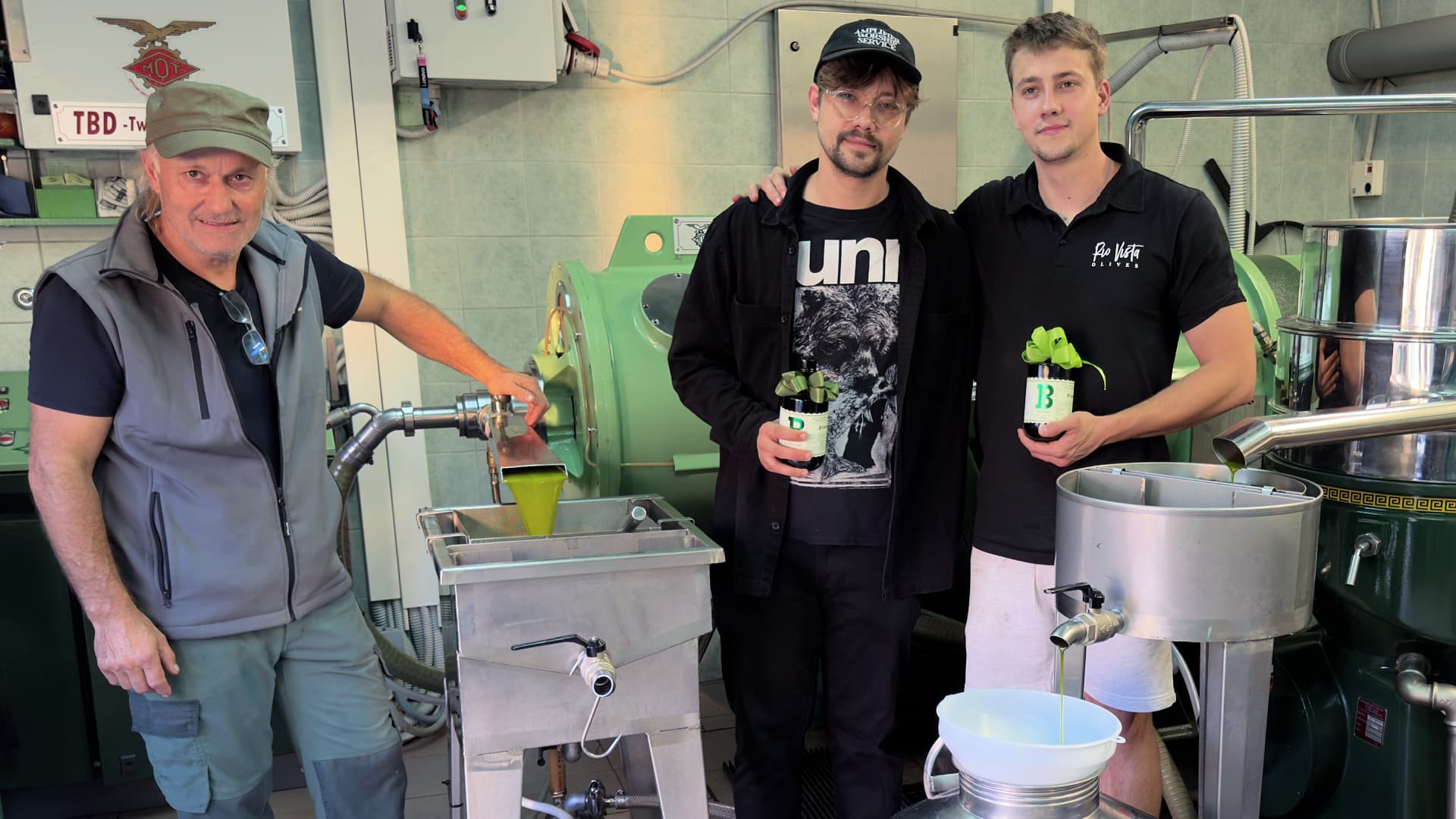 Freshly milled olive oil flows at the Babič family mill in Babiči